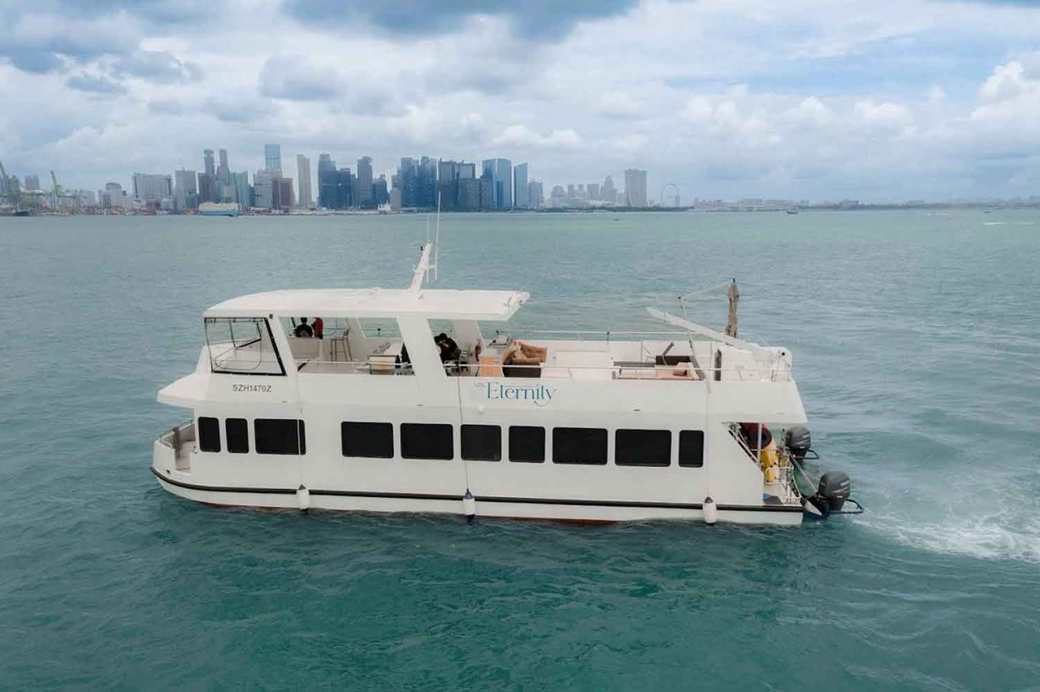 Private charter yacht with city skyline