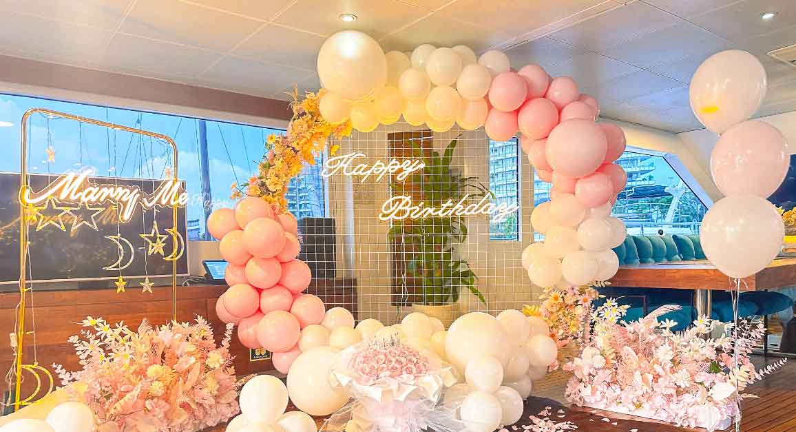 Birthday decoration on yacht with balloons and party decor