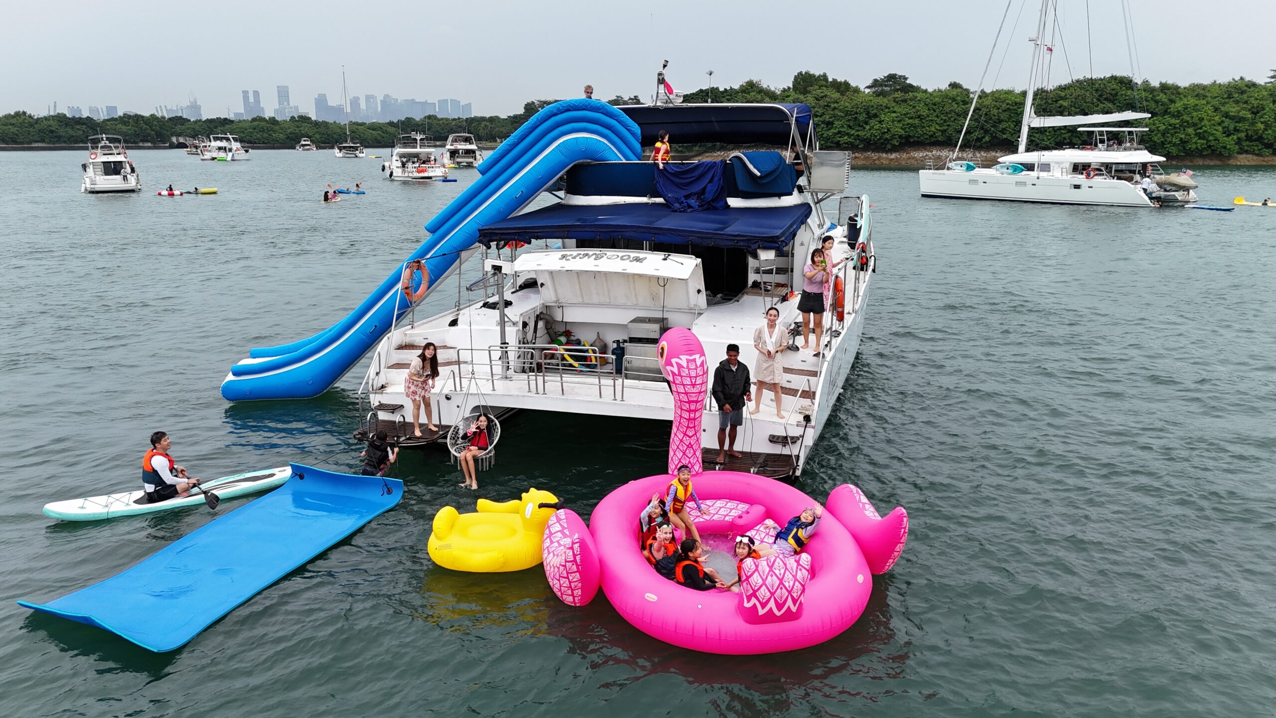 water activities with giant slide, giant float and water toys on yacht charters in Singapore