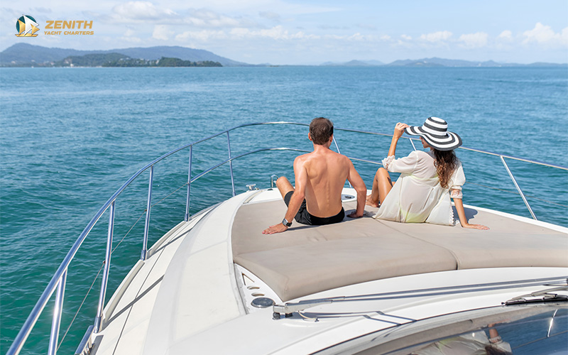 Friends on a yacht celebrating with glasses of champagne
