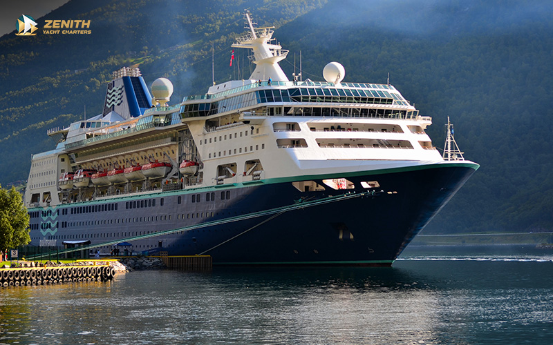 A large cruise ship docked in a port.