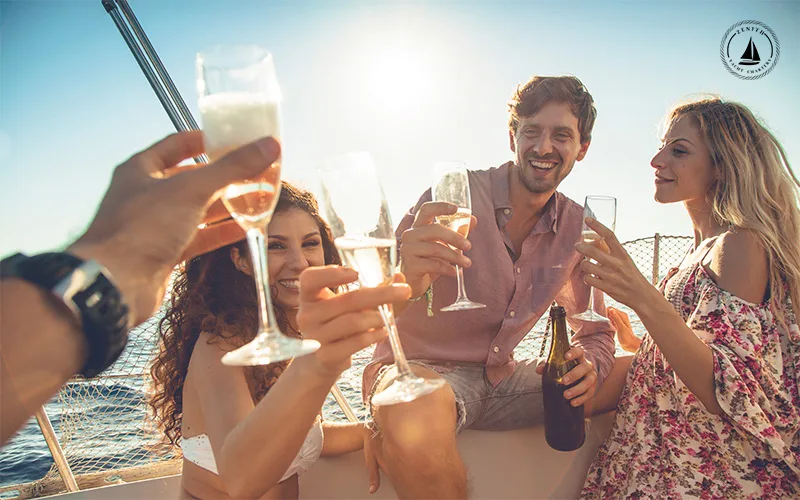 Friends-celebrating-a-yacht-birthday-party-with-champagne-and-a-sea-breeze