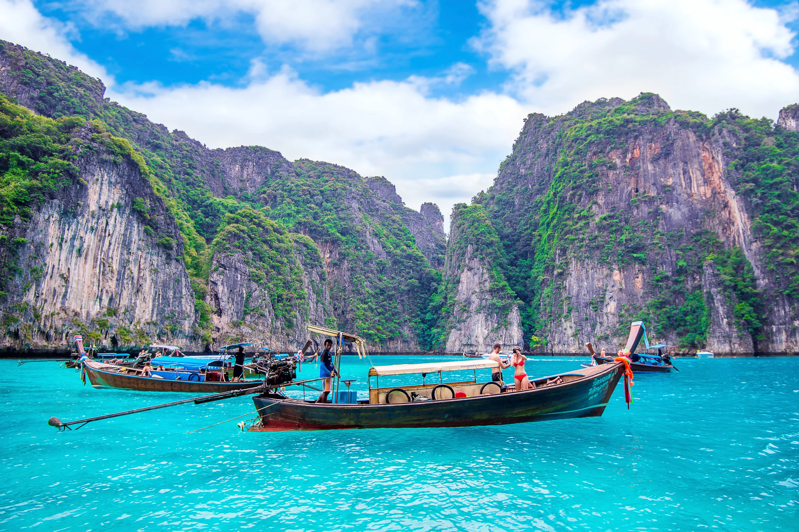 KRABI - DECEMBER 1: Long boat and tourist at Maya bay in Phi Phi