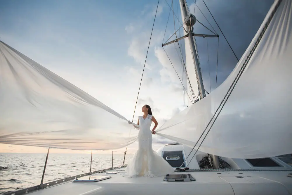 happy-bride-yacht-white-yacht-with-sail-set-goes-along-island-1